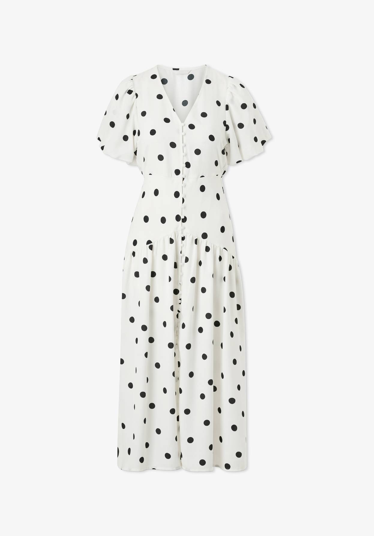 Valkoinen mekko mustilla pilkuilla.